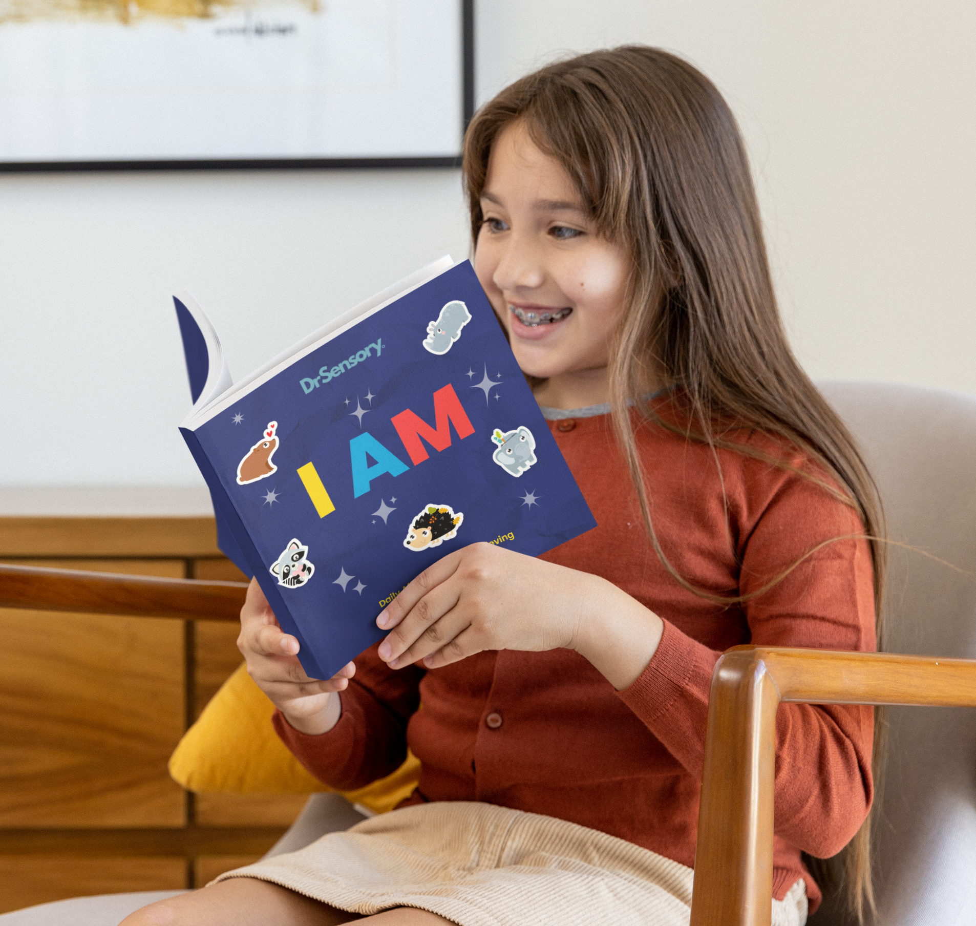 mockup-of-a-girl-reading-a-square-book-at-home-m26927_09c00772-7a76-4472-a6f6-735238b7b65a