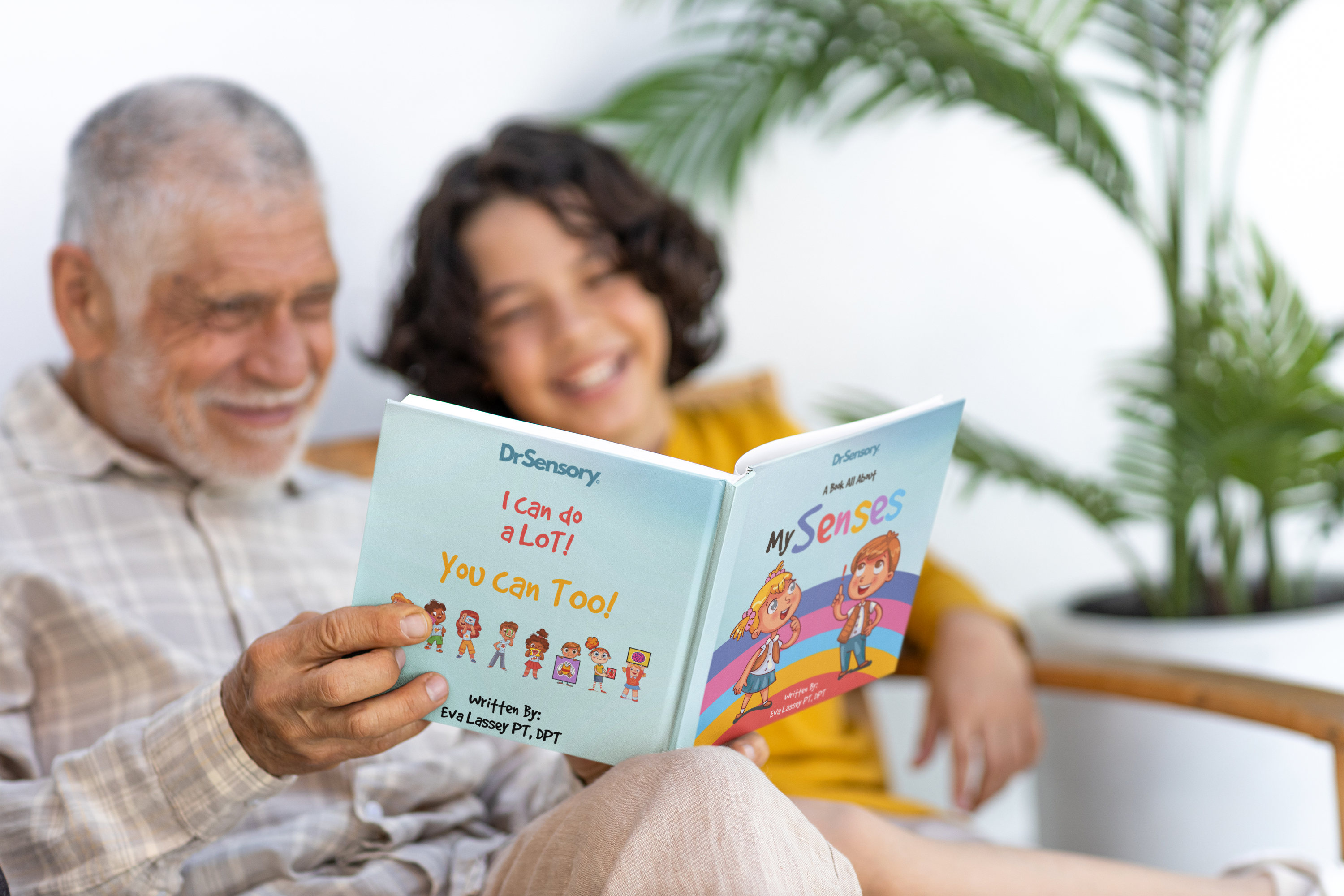 mockup-of-a-happy-senior-man-reading-a-book-to-his-grandson-m39439_2_1