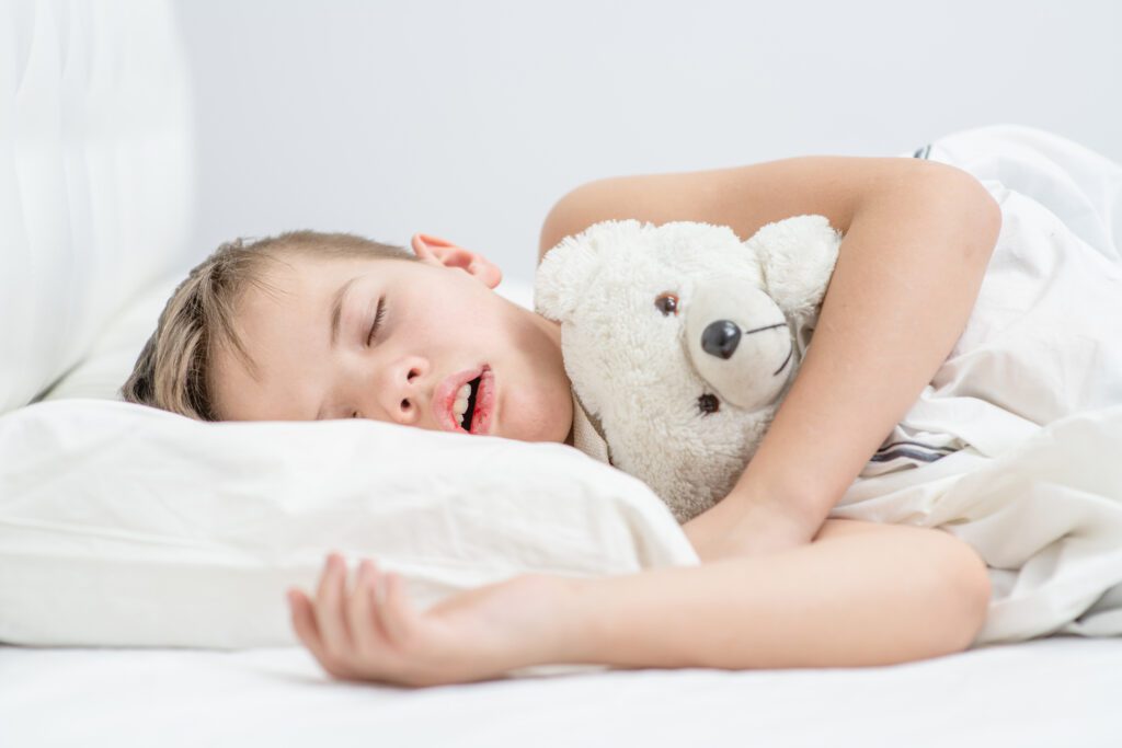 Little,Boy,With,Toy,Bear,Is,Sleeping,With,His,Mouth