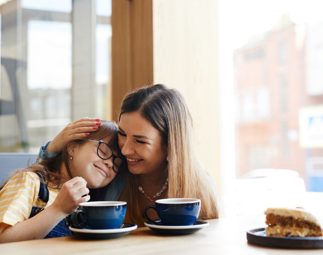 A mother and daughter laughing together