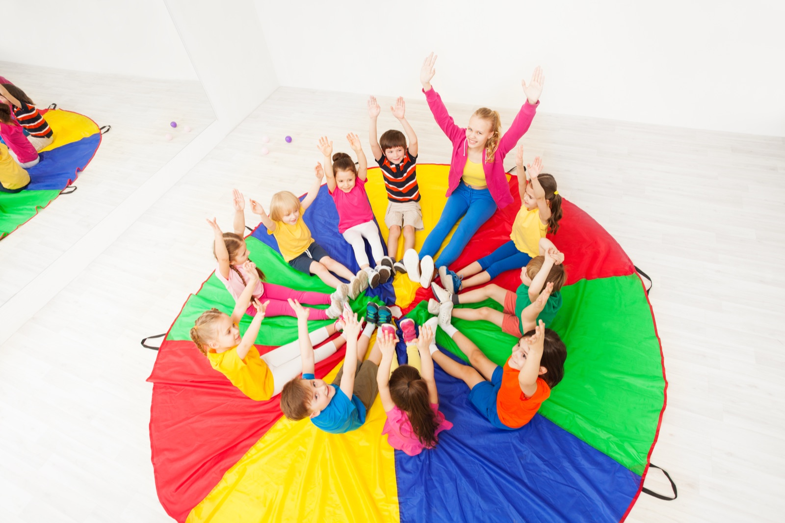A group of children sitting in a circle during a therapy session